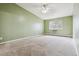Spacious bedroom featuring neutral carpet, a ceiling fan and lots of natural light at 3022 S Wheeling Way # 407, Aurora, CO 80014