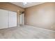 Carpeted bedroom featuring a spacious closet and natural light at 3022 S Wheeling Way # 407, Aurora, CO 80014