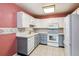 Updated kitchen featuring white appliances, tiled backsplash, and ample cabinet space at 3022 S Wheeling Way # 407, Aurora, CO 80014