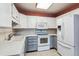 Modern kitchen featuring ample cabinet space, tiled floors, and modern appliances at 3022 S Wheeling Way # 407, Aurora, CO 80014