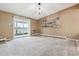 Spacious living room with carpet, a sliding glass door, and neutral decor at 3022 S Wheeling Way # 407, Aurora, CO 80014