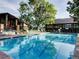 Sparkling outdoor pool with lounge chairs, ideal for summer relaxation and enjoyment at 3022 S Wheeling Way # 407, Aurora, CO 80014