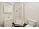 Basement bathroom with corner shower and toilet at 4001 E 94Th Ave # H, Thornton, CO 80229