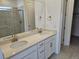 Bright bathroom with double vanity, framed mirrors, and modern fixtures at 17146 W 92Nd Loop, Arvada, CO 80007