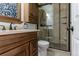 Updated bathroom with a walk-in shower and modern vanity at 1869 S Union Blvd, Lakewood, CO 80228