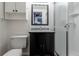 Well-lit bathroom with modern vanity, granite countertop, and a stand-up shower at 1869 S Union Blvd, Lakewood, CO 80228