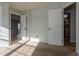 Spacious bedroom with doors to other rooms and ample sunlight at 1869 S Union Blvd, Lakewood, CO 80228