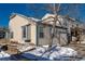 Beige townhouse exterior, snow on ground at 1869 S Union Blvd, Lakewood, CO 80228