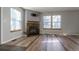 Living room with corner fireplace and tile floors at 1869 S Union Blvd, Lakewood, CO 80228