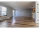 Living room with tile floors, access to kitchen, and sliding glass doors at 1869 S Union Blvd, Lakewood, CO 80228