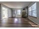 Spacious living room with tile floors, fireplace, and lots of natural light at 1869 S Union Blvd, Lakewood, CO 80228