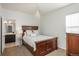 Serene bedroom with a chandelier and ensuite bathroom at 10535 Starglow Ct, Highlands Ranch, CO 80126