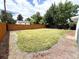 Spacious backyard with manicured lawn and wooden fence, perfect for outdoor activities and relaxation at 2285 S Knox Ct, Denver, CO 80219