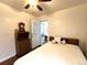 The bedroom features a well-lit space, offering serene views, and is naturally cozy at 2285 S Knox Ct, Denver, CO 80219