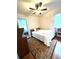 Comfortable bedroom is bathed in natural light and provides a calming retreat at 2285 S Knox Ct, Denver, CO 80219