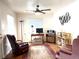 Cozy living room with comfortable seating, a ceiling fan, and natural light at 2285 S Knox Ct, Denver, CO 80219
