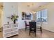 Bright dining area with modern light fixture and nearby window to view the exterior scenery at 23688 E Ida Dr # E, Aurora, CO 80016