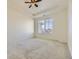 Spacious main bedroom with neutral carpet, a ceiling fan, and a window offering natural light at 23688 E Ida Dr # E, Aurora, CO 80016