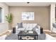 Comfortable living room with neutral tones and modern art at 8183 S Yosemite Ct, Centennial, CO 80112