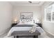 Inviting main bedroom features tray ceiling, soft lighting, and a comfortable bench at 8183 S Yosemite Ct, Centennial, CO 80112