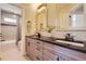 Modern bathroom featuring a double vanity with stylish cabinetry and bright lighting at 2235 S Cherokee St, Denver, CO 80223