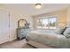 Cozy bedroom with a calm color scheme with a window view at 2235 S Cherokee St, Denver, CO 80223