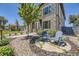 Stylish home boasting a stone exterior, beautifully landscaped yard, and inviting Adirondack chairs at 2235 S Cherokee St, Denver, CO 80223