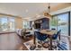 Spacious living area featuring hardwood floors, modern decor, and a dining area, creating an inviting and stylish space at 2235 S Cherokee St, Denver, CO 80223