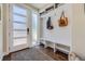 Well-organized mudroom featuring a storage bench, coat hooks, and stylish decor, located near the entrance at 2235 S Cherokee St, Denver, CO 80223