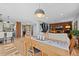 Open-concept dining area with hardwood floors and modern finishes at 1485 S Jasmine Way, Denver, CO 80224