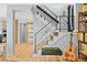 Open-concept living room with modern staircase, wood floors, and natural light, perfect for entertaining at 1485 S Jasmine Way, Denver, CO 80224