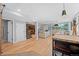 Bright, open-concept living room with hardwood floors, modern lighting, and comfortable seating at 1485 S Jasmine Way, Denver, CO 80224