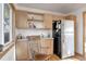 Kitchen with wood cabinets and black refrigerator at 2825 Elm Ave, Boulder, CO 80305