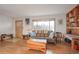 Spacious living area with hardwood floors and built-in shelving at 2825 Elm Ave, Boulder, CO 80305