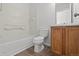 Functional bathroom showcasing a tub/shower combination and a wood-look vanity sink at 19817 E 47Th Pl, Denver, CO 80249