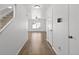 Bright entryway that leads to the living area, features hardwood floors and white walls at 19817 E 47Th Pl, Denver, CO 80249