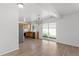 Bright kitchen and dining area features stainless appliances and sliding glass doors at 19817 E 47Th Pl, Denver, CO 80249
