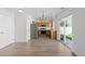 Open kitchen with stainless steel appliances, light wood cabinetry, and access to a patio at 19817 E 47Th Pl, Denver, CO 80249
