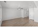Spacious living room features wood-look floors, a ceiling fan and ample natural light at 19817 E 47Th Pl, Denver, CO 80249