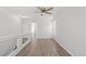 Bright and airy loft space featuring wood-look flooring and a stylish ceiling fan for added comfort at 19817 E 47Th Pl, Denver, CO 80249