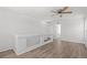 Bright and airy loft space featuring wood-look flooring and a stylish ceiling fan for added comfort at 19817 E 47Th Pl, Denver, CO 80249