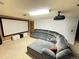Basement entertainment room featuring a projector, screen, and sectional sofa at 596 Trumbull Ln, Monument, CO 80132
