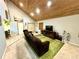 Inviting living room with vaulted wood ceiling, plush seating, and a cozy fireplace at 596 Trumbull Ln, Monument, CO 80132