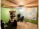 Unique home office space with wood ceilings, large world map, and natural light at 596 Trumbull Ln, Monument, CO 80132