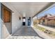 Attached carport featuring a covered entrance and storage door for added convenience at 5567 E Asbury Ave, Denver, CO 80222