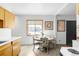 Cozy dining area with a large window, neutral decor, and a view of the neighborhood at 5567 E Asbury Ave, Denver, CO 80222