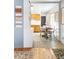 Bright dining area adjacent to the kitchen featuring a window and an eat-in table at 5567 E Asbury Ave, Denver, CO 80222