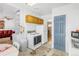 Functional kitchen with an adjacent dining area featuring white appliances and light wood cabinets at 5567 E Asbury Ave, Denver, CO 80222