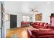 Inviting living room featuring hardwood floors, a large window, and comfortable seating at 5567 E Asbury Ave, Denver, CO 80222