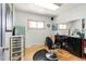 Salon room featuring a salon chair and sink with an accent teal refrigerator at 5567 E Asbury Ave, Denver, CO 80222